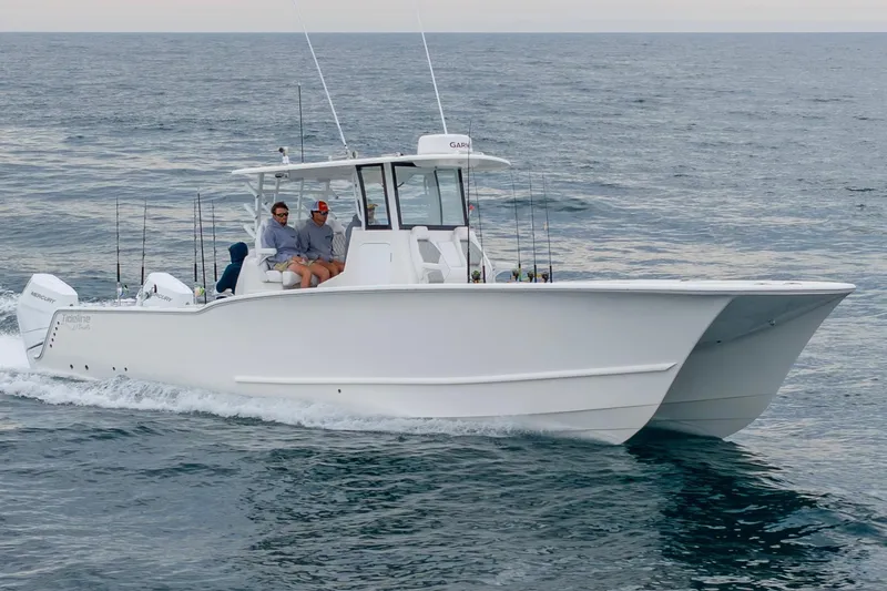 Slide: The Image of 2026 Tideline 365 Offshore boat cruising on open water with passengers. - 30