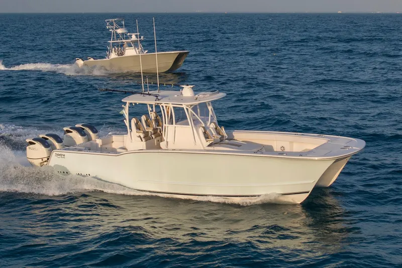 Slide: The Image of 2026 Tideline 365 Offshore boat cruising on open water with another boat nearby. - 32