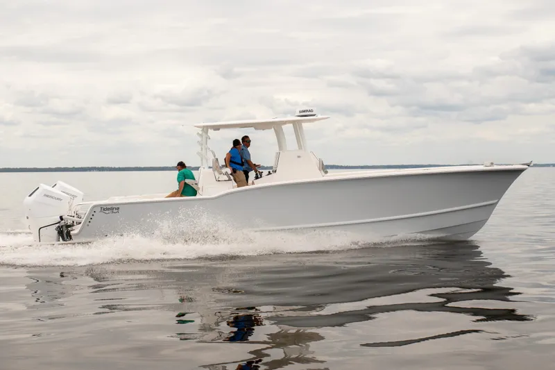 Slide: The Image of 2026 Tideline 365 Offshore boat cruising on calm waters under cloudy skies. - 4