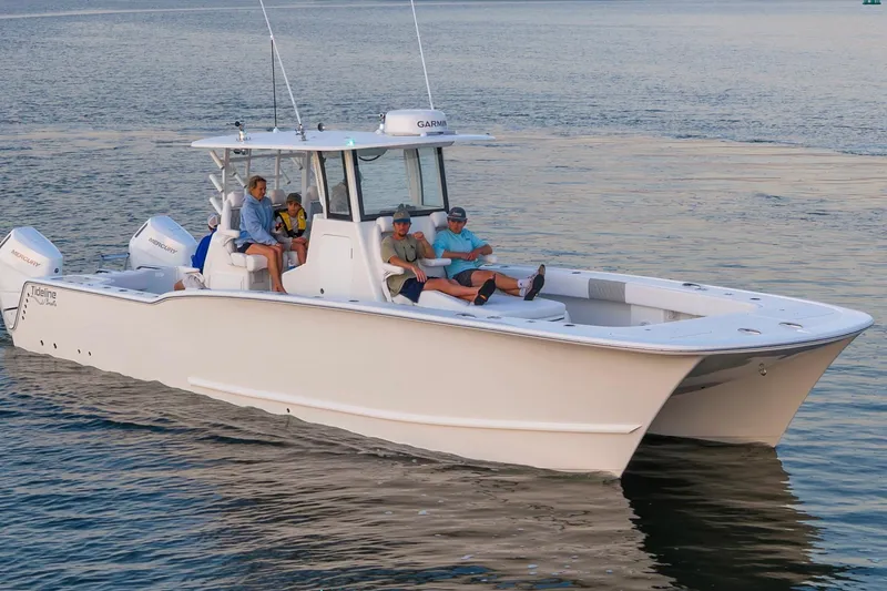 Slide: The Image of 2026 Tideline 365 Offshore boat cruising with passengers on calm waters. - 40