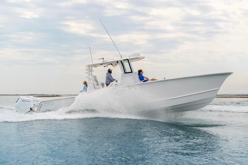 Slide: The Image of 2026 Tideline 365 Offshore boat cruising on open water, showcasing sleek design and performance. - 41