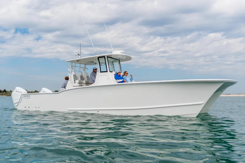 Slide: The Image of 2026 Tideline 365 Offshore boat cruising on calm waters under a cloudy sky. - 42