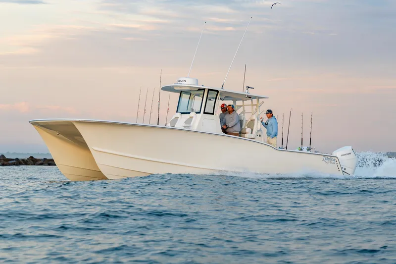 Slide: The Image of 2026 Tideline 365 Offshore boat cruising on open water at sunset. - 45