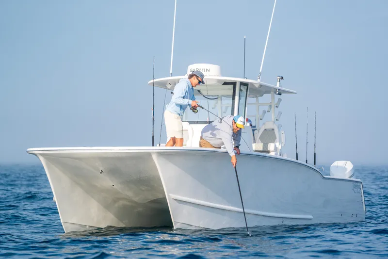 Slide: The Image of 2026 Tideline 365 Offshore boat with two people fishing at sea. - 47