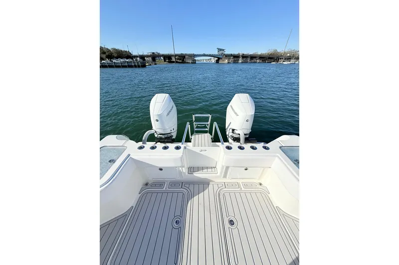 Slide: The Image of 2026 Tideline 365 Offshore boat with dual engines on calm water. - 57