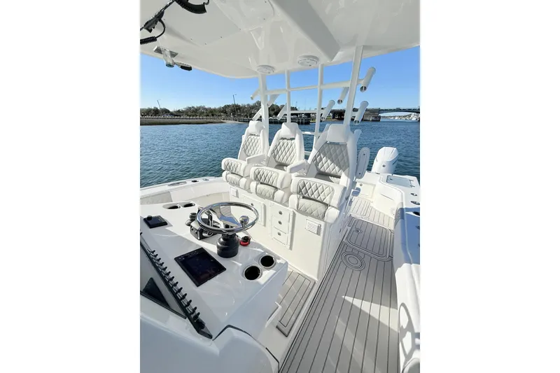 Slide: The Image of 2026 Tideline 365 Offshore boat interior with luxurious seating and modern helm controls. - 58