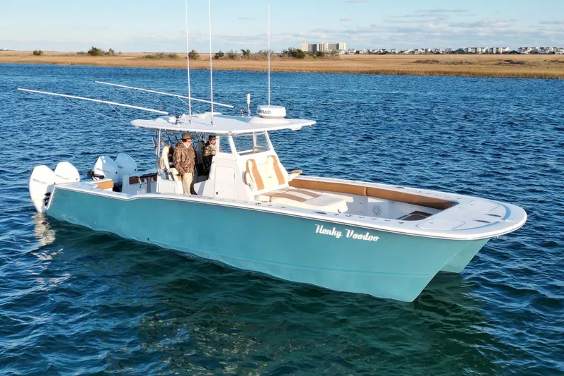 Slide: The Image of 2026 Tideline 365 Offshore boat on water, featuring sleek design and powerful engines. - 6