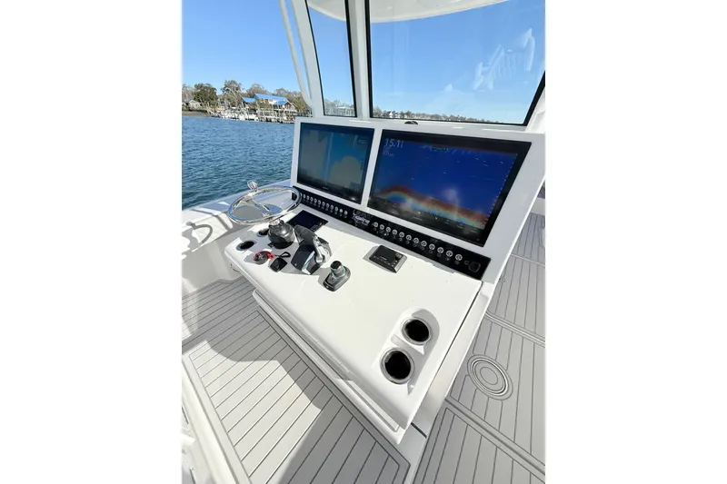 Slide: The Image of Helm of 2026 Tideline 365 Offshore boat with dual screens and controls. - 60
