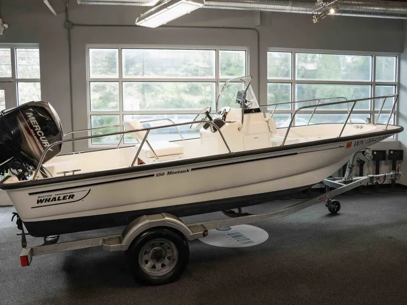 The Image of 2014 Boston Whaler 150 Montauk boat in showroom. - 1