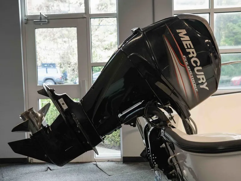 Slide: The Image of 2014 Boston Whaler 150 Montauk with Mercury outboard motor. - 11