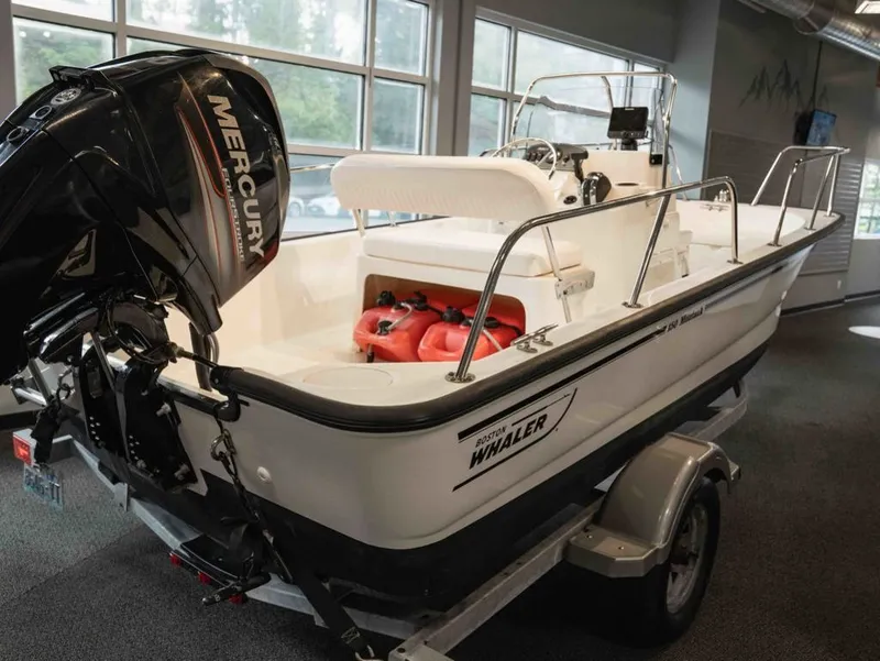 Slide: The Image of 2014 Boston Whaler 150 Montauk boat with Mercury outboard motor. - 3