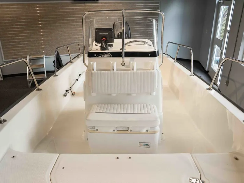 Slide: The Image of Interior view of a 2014 Boston Whaler 150 Montauk boat. - 8