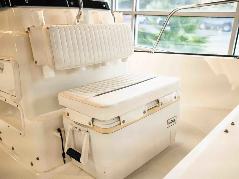 Slide: The Image of Interior of a 2014 Boston Whaler 150 Montauk boat with seating bench. - 9