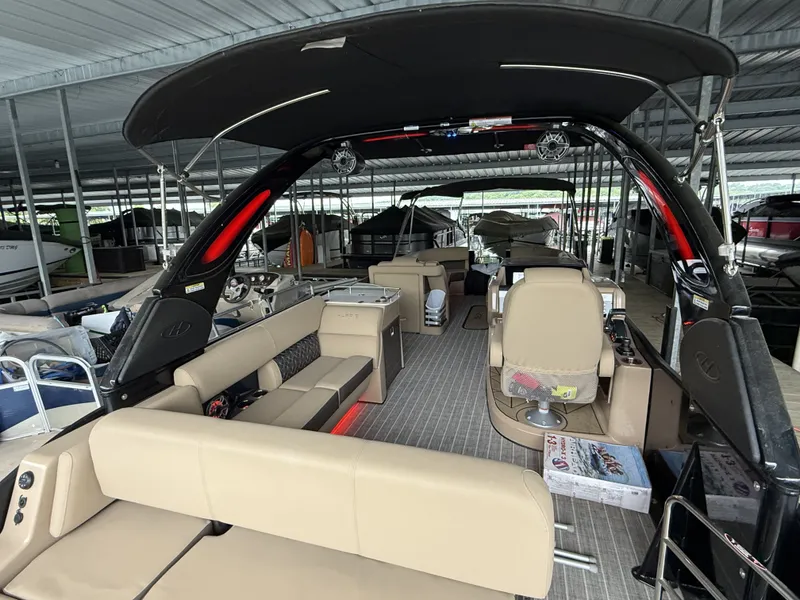 Slide: The Image of Interior of a 2023 Harris 270GM pontoon boat in a covered dock. - 12