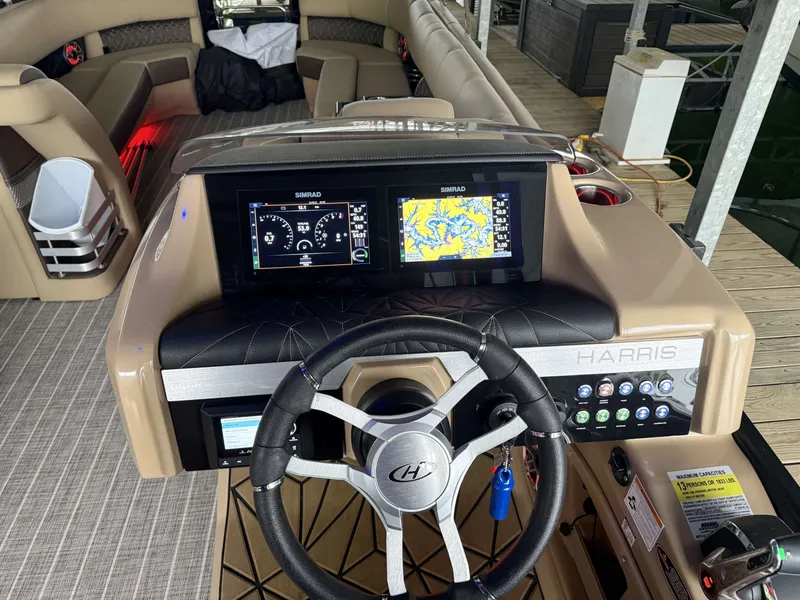 Slide: The Image of Harris 270GM 2023 boat console with Simrad displays and controls. - 14
