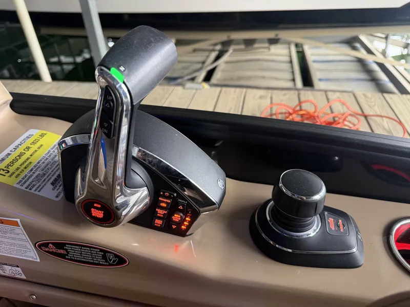 Slide: The Image of Harris 270GM 2023 boat controls with throttle and joystick. - 17