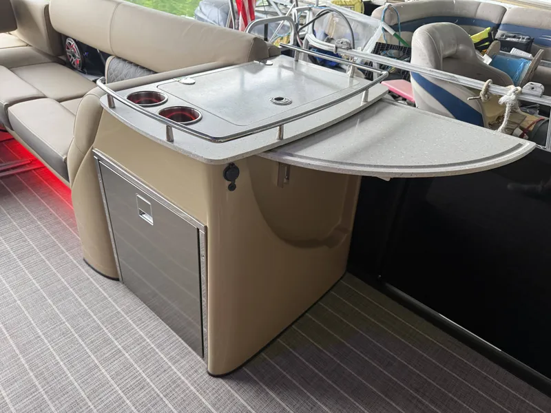 Slide: The Image of Harris 270GM 2023 boat kitchenette with counter and cup holders. - 18