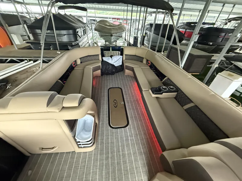 Slide: The Image of Interior of a 2023 Harris 270GM pontoon boat with luxurious seating. - 19