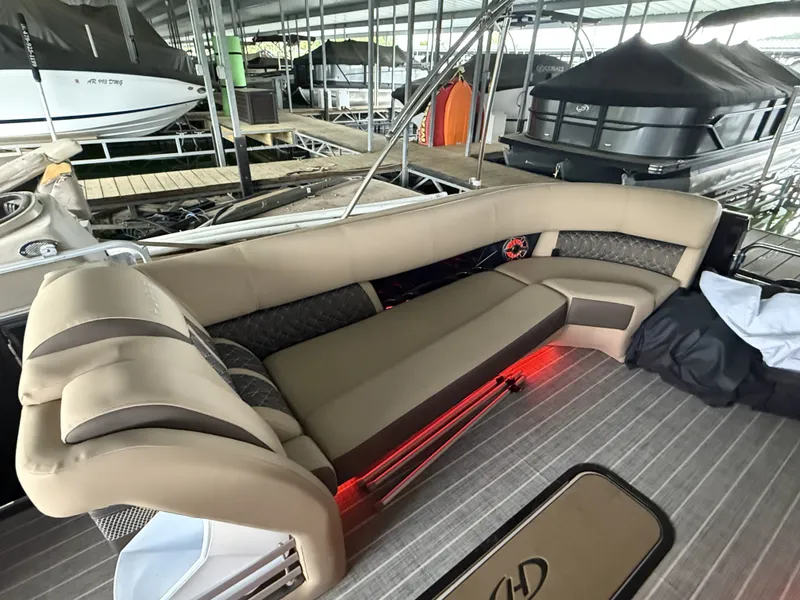 Slide: The Image of Luxurious seating on a 2023 Harris 270GM boat. - 20