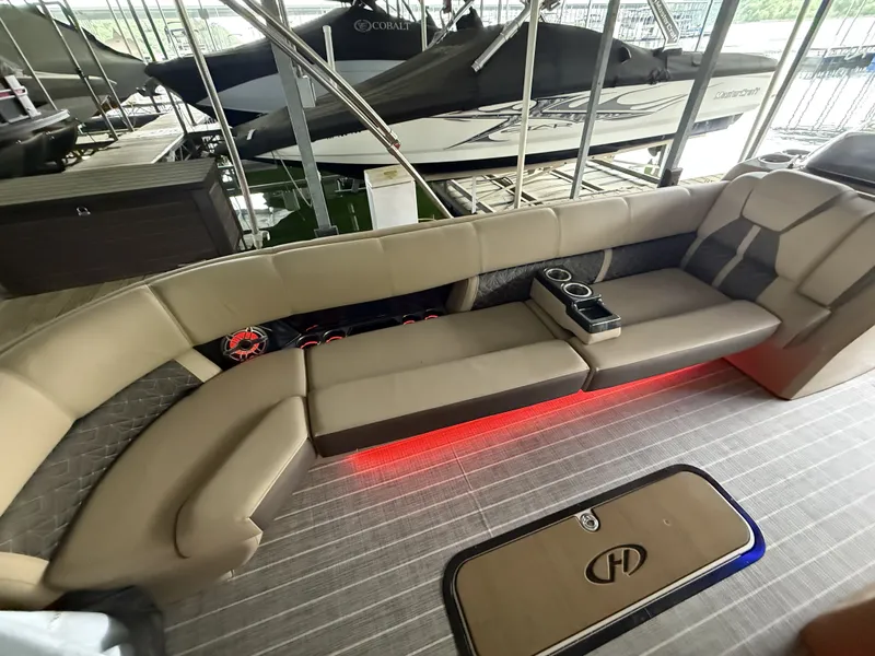 Slide: The Image of Interior of a 2023 Harris 270GM boat with LED lighting and comfortable seating. - 21