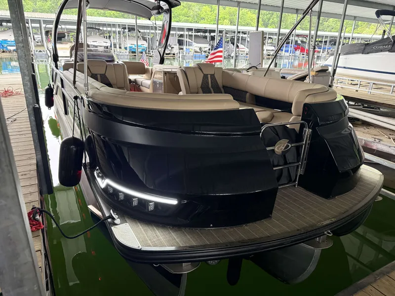 Slide: The Image of Luxurious Harris 270GM pontoon boat docked, model year 2023. - 25