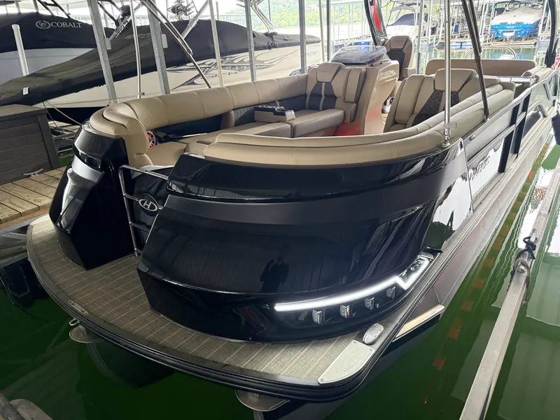Slide: The Image of Luxurious Harris 270GM pontoon boat, 2023 model, docked at marina. - 26