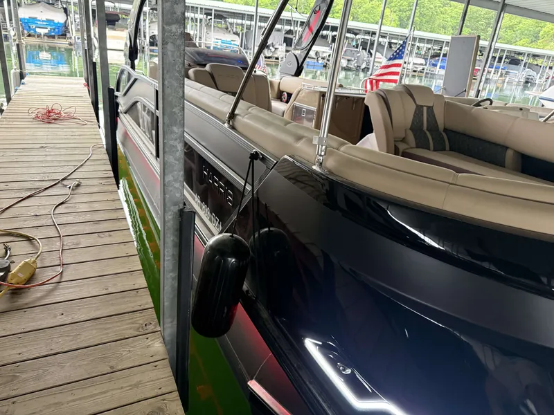 Slide: The Image of Harris 270GM boat from 2023 docked at a marina. - 27