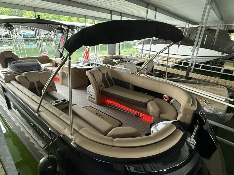 Slide: The Image of Luxurious 2023 Harris 270GM pontoon boat with LED lighting in marina. - 28