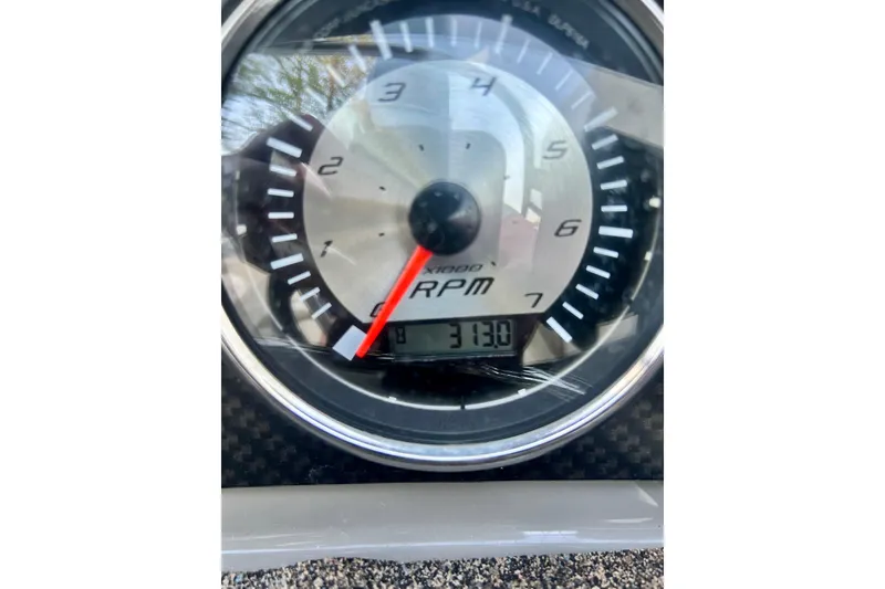 Slide: The Image of Close-up of a 2017 Stingray 204 LR tachometer showing 3130 RPM. - 3