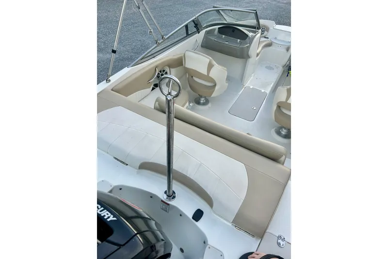 Slide: The Image of 2017 Stingray 204 LR boat interior with seating and steering wheel. - 8