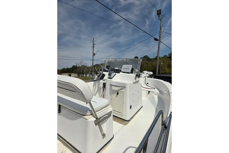 Slide: The Image of 2000 Boston Whaler 18 Dauntless boat interior with steering console and seating. - 5