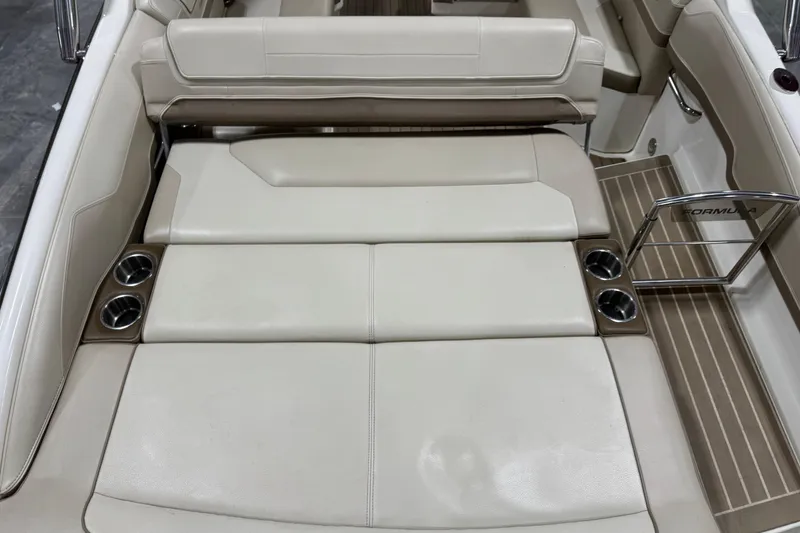 Slide: The Image of 2014 Formula 270 Bowrider interior with beige seating and cup holders. - 5