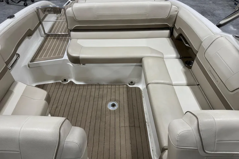 Slide: The Image of 2014 Formula 270 Bowrider interior with beige seating and teak-style flooring. - 7