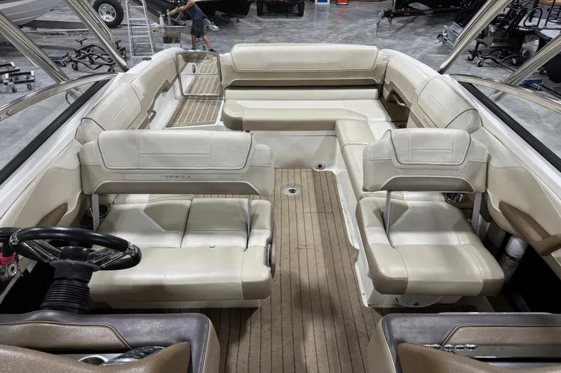 Slide: The Image of 2014 Formula 270 Bowrider interior with beige seating and steering wheel. - 8