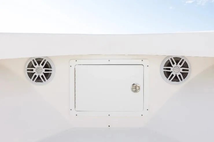 Slide: The Image of 2026 Privateer 18 Retriever boat speakers and storage compartment on deck. - 5