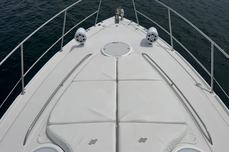 Slide: The Image of Bow view of 2009 Four Winns V358 boat with white deck and speakers. - 10