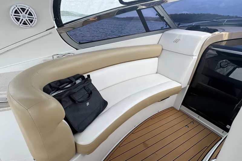 Slide: The Image of Luxurious seating area on a 2009 Four Winns V358 boat with a scenic water view. - 16