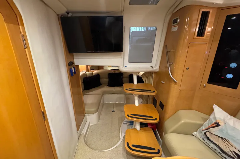 Slide: The Image of Interior of 2009 Four Winns V358 yacht with cozy seating and mounted TV. - 23