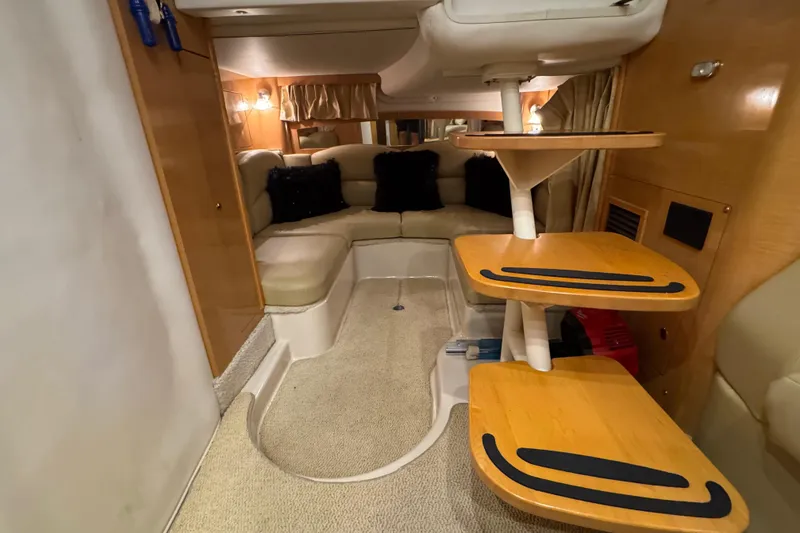 Slide: The Image of 2009 Four Winns V358 yacht interior with cozy seating and wooden steps. - 24