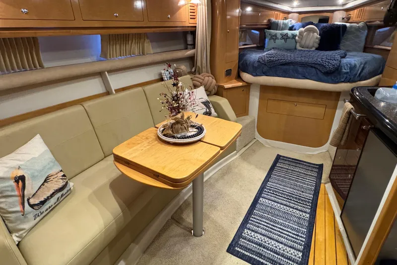 Slide: The Image of Luxurious 2009 Four Winns V358 yacht interior with cozy seating and elegant decor. - 26