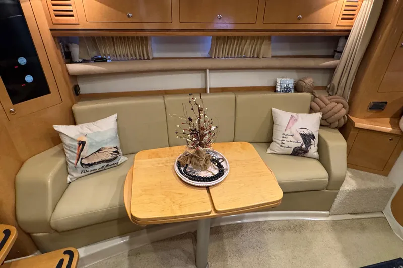 Slide: The Image of Interior of 2009 Four Winns V358 yacht with cozy seating and decorative pillows. - 27