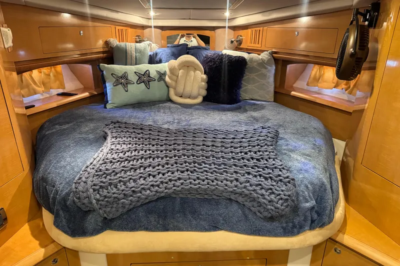 Slide: The Image of Cozy cabin interior of 2009 Four Winns V358 with plush bedding and decorative pillows. - 31