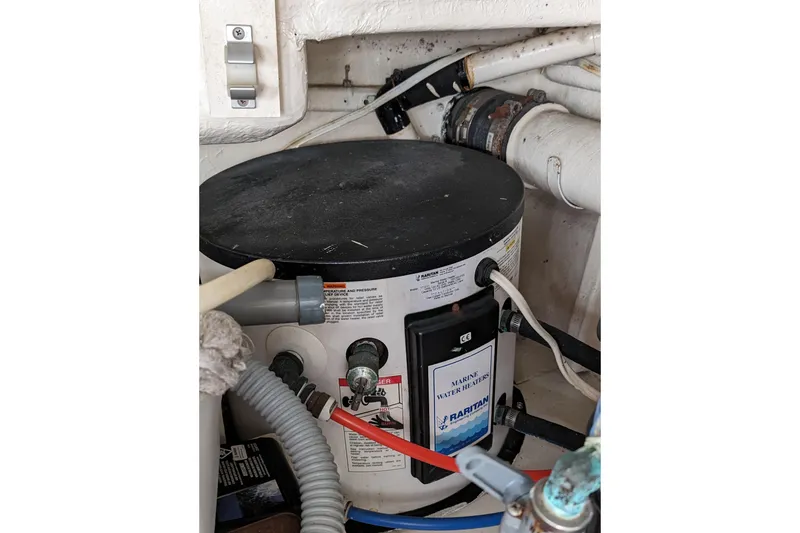 Slide: The Image of Marine water heater in a 1990 Neptunus Sedan 148 engine room. - 15