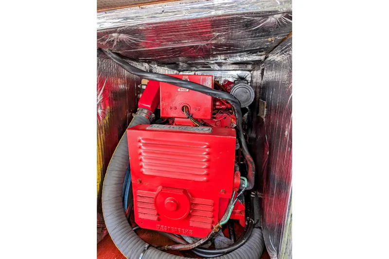 Slide: The Image of Red engine compartment of a 1990 Neptunus Sedan 148 boat. - 16