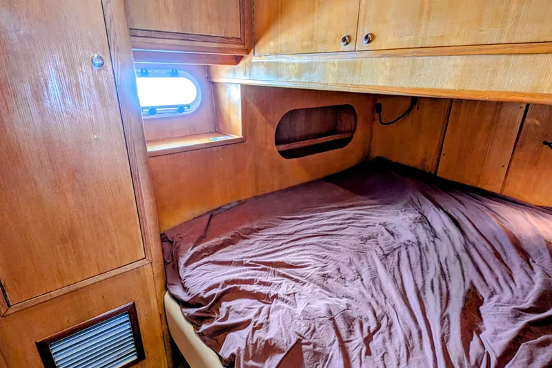 Slide: The Image of Cozy cabin interior of 1990 Neptunus Sedan 148 with wooden finish and porthole window. - 22