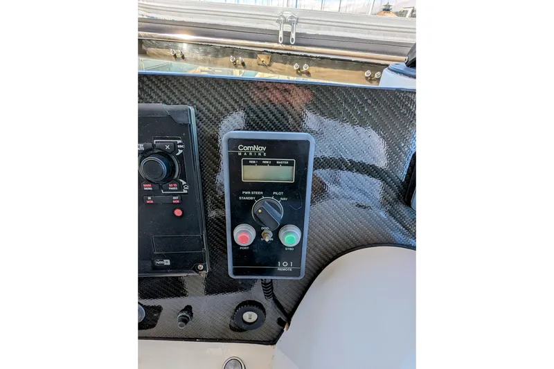 Slide: The Image of Control panel of a 1990 Neptunus Sedan 148 with ComNav Marine equipment. - 25