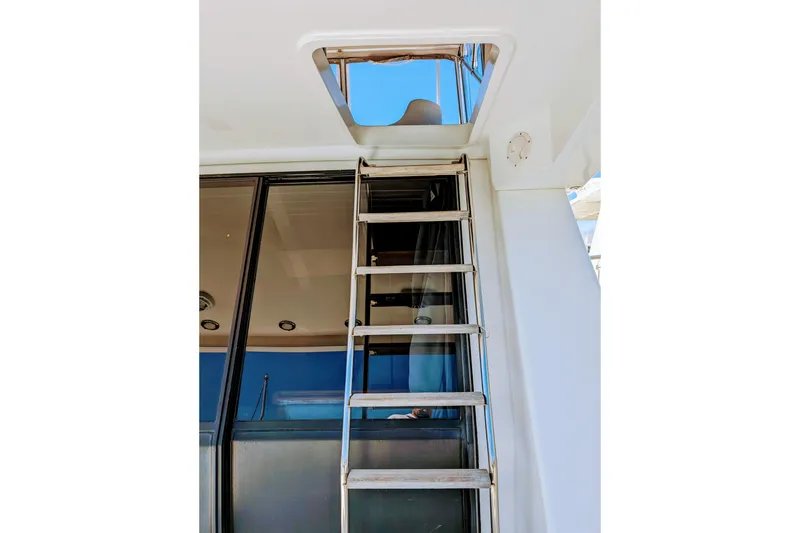 Slide: The Image of Ladder leading to upper deck on 1990 Neptunus Sedan 148 yacht. - 26