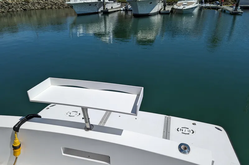 Slide: The Image of Boat deck of 1990 Neptunus Sedan 148 at marina with calm water. - 37