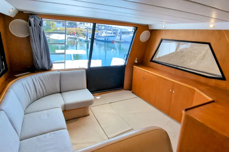 Slide: The Image of Luxurious interior of 1990 Neptunus Sedan 148 yacht with waterfront view. - 7