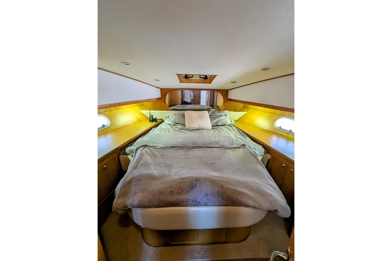 Slide: The Image of Cozy bedroom interior of 1990 Neptunus Sedan 148 yacht with plush bedding. - 8